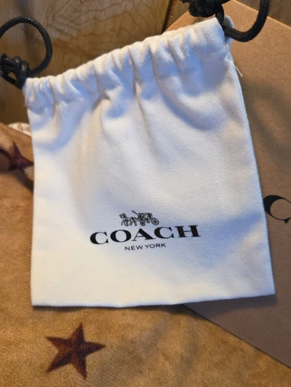 Coach Gold Daisy Pendant Bracelet with Beige Accessories
